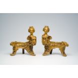 A pair of French Louis XIV style bronze andirons crowned with a regal lady's bust in the manner of F