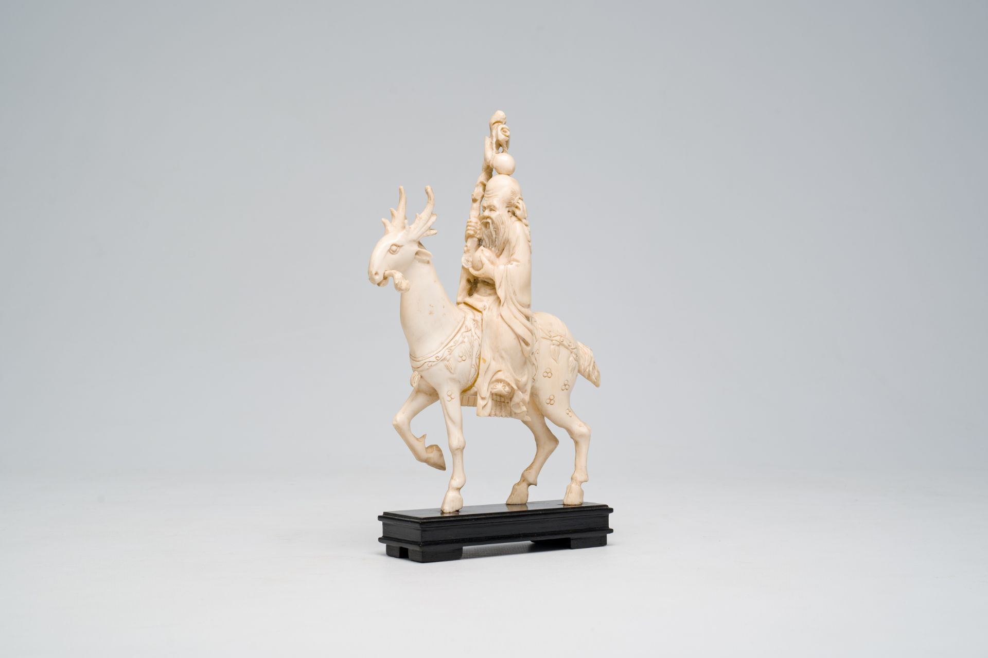 A Chinese ivory 'Laozi on a deer' group, 19th C.