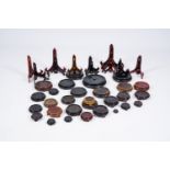 A collection of Chinese carved wood stands and plate holders, 20th C.