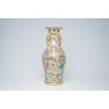 A Chinese baluster shaped Canton famille rose vase with palace scenes, 19th C.