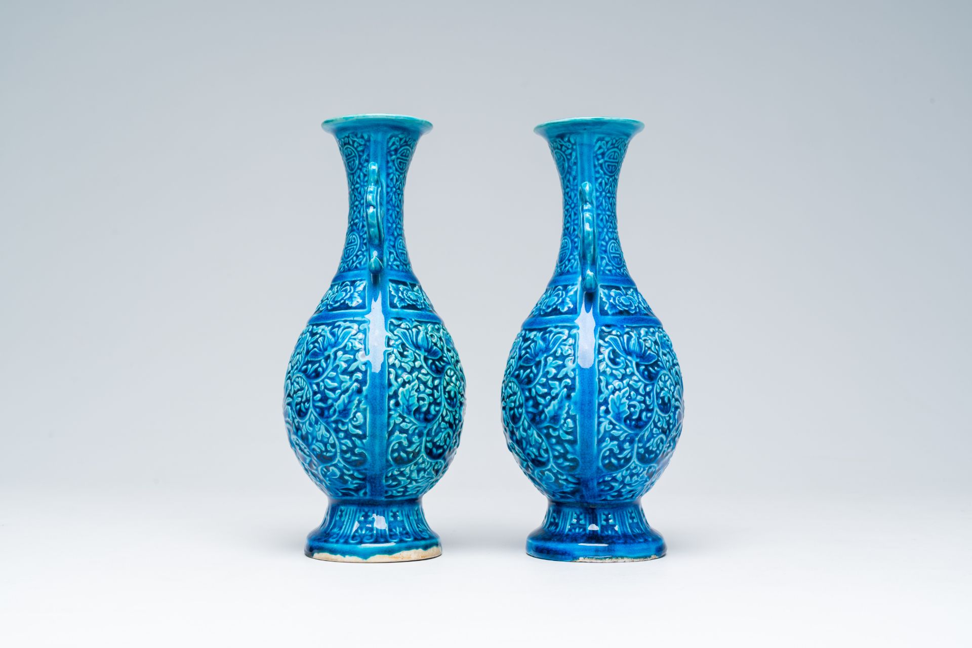 A pair of Chinese turquoise glazed 'lotus' vases, Republic, 20th C. - Image 4 of 6