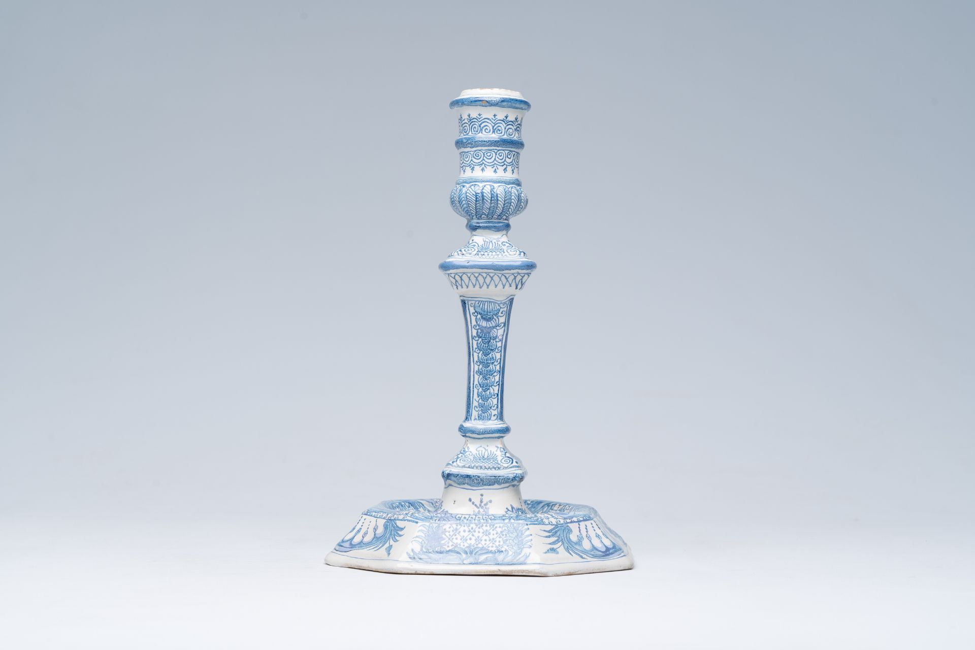A German blue and white richly decorated earthenware candlestick, Nuremberg, 18th C. - Image 2 of 7