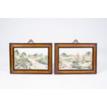 Two framed Chinese famille rose 'animated river landscape' plaques, 20th C.