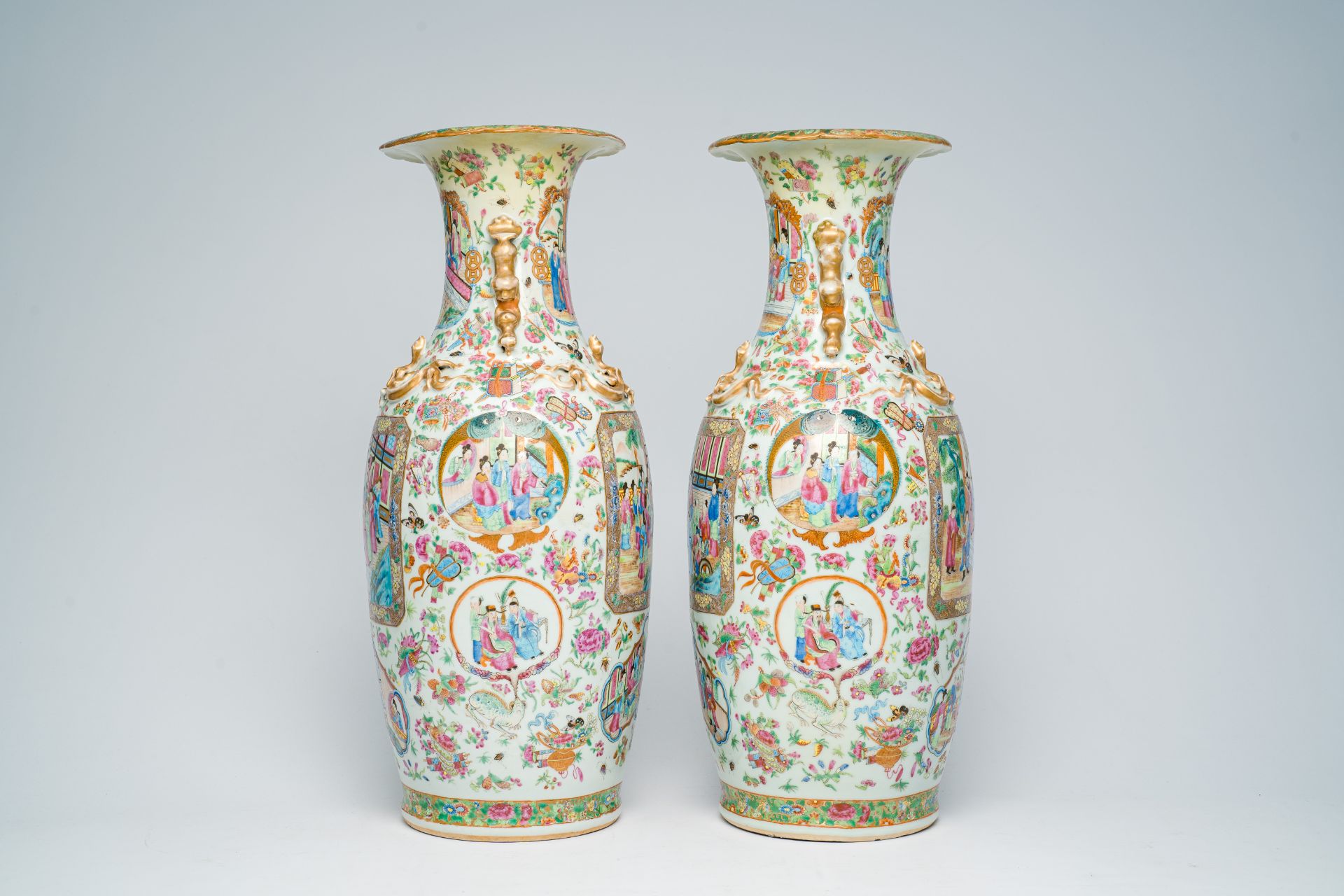 A pair of Chinese Canton famille rose vases with palace scenes and floral design, 19th C. - Image 2 of 7