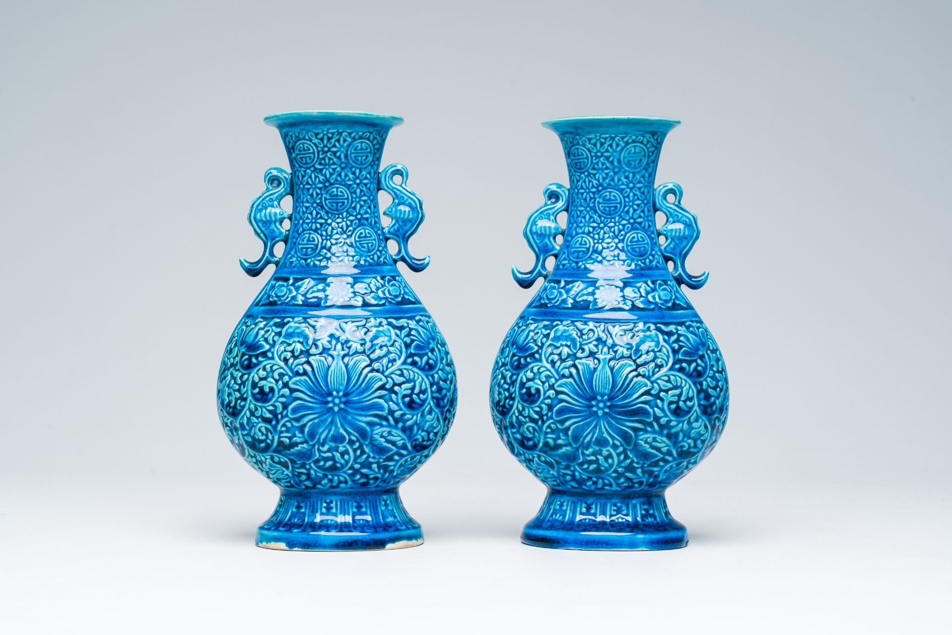 A pair of Chinese turquoise glazed 'lotus' vases, Republic, 20th C. - Image 3 of 6
