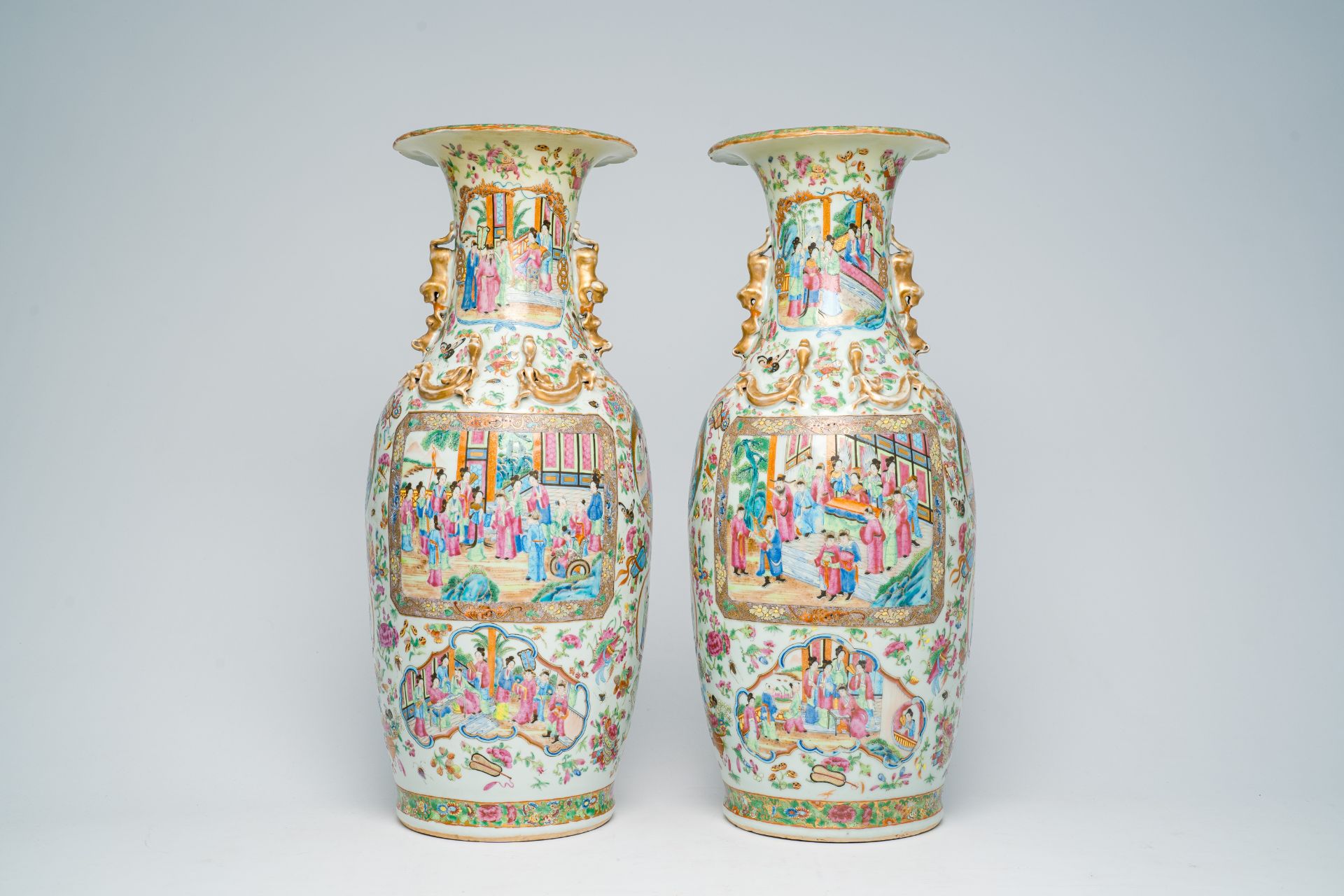A pair of Chinese Canton famille rose vases with palace scenes and floral design, 19th C. - Image 3 of 7