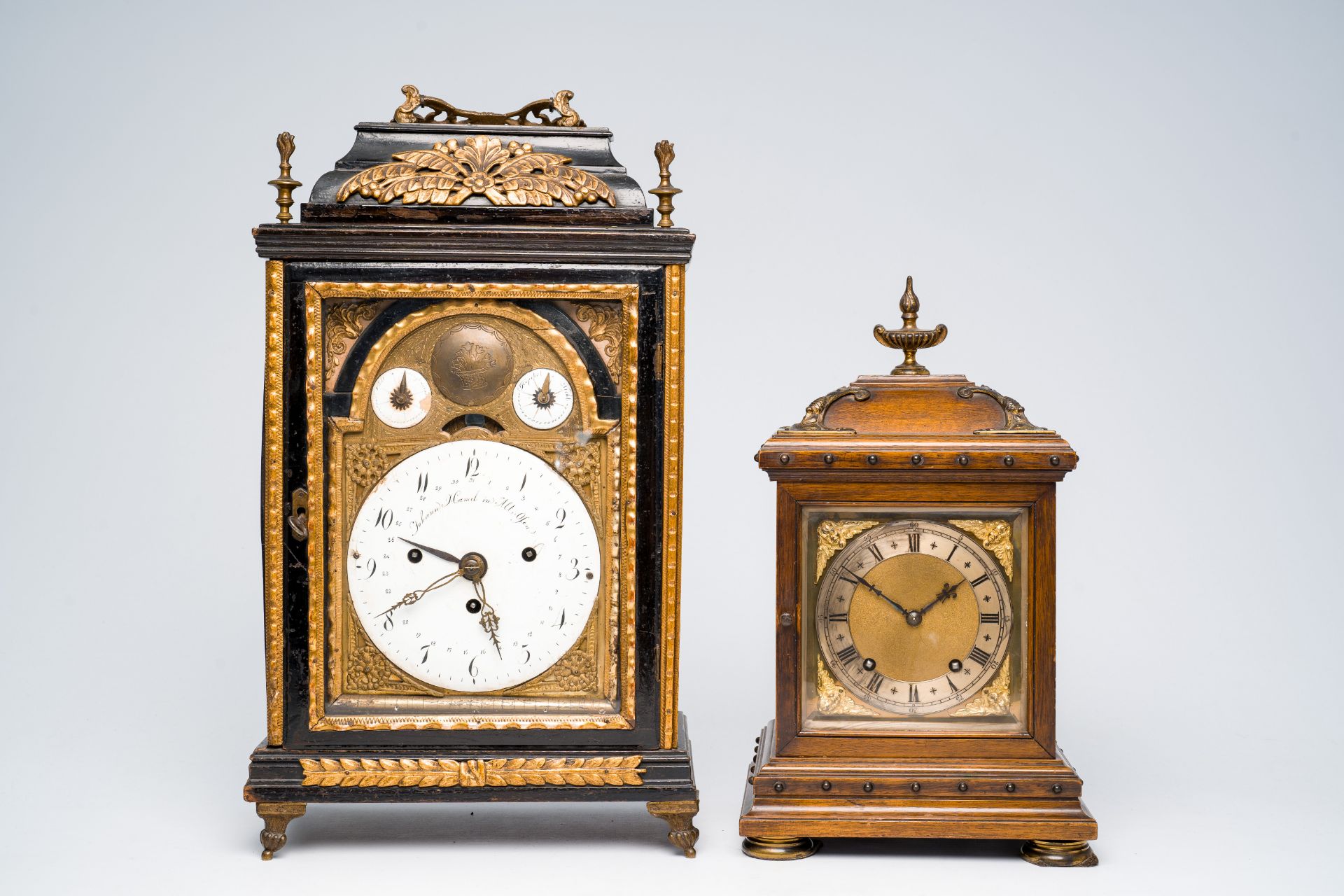 Two German bronze mounted table clocks in (ebonized) wood, 19th/20th C.