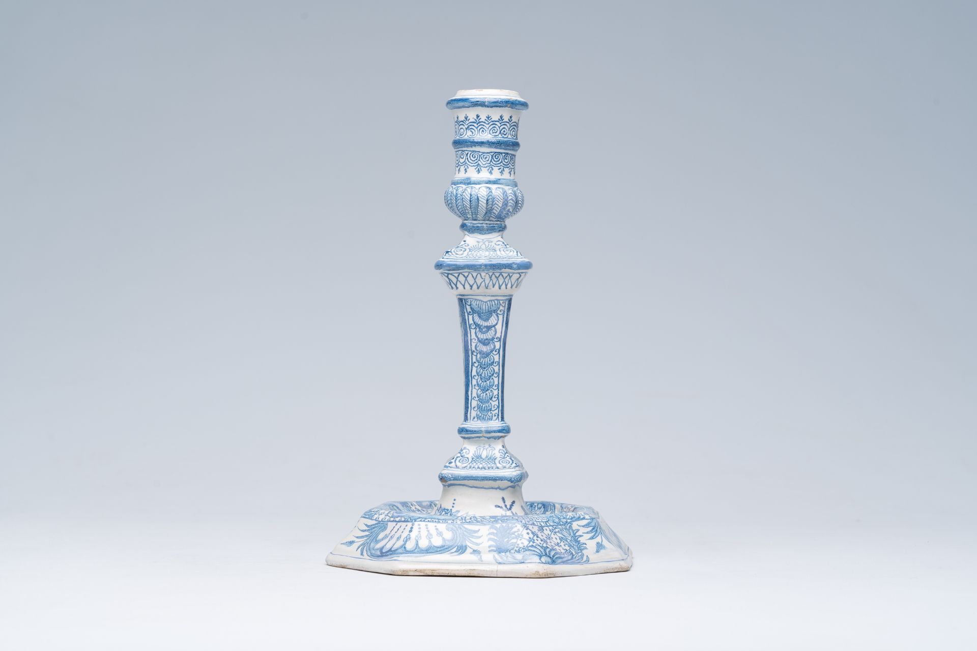A German blue and white richly decorated earthenware candlestick, Nuremberg, 18th C. - Image 3 of 7