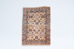 A Persian Kashan rug with floral design, wool on cotton, 20th C.