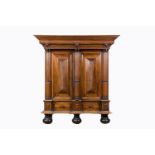 A Dutch partly ebonised wood two-door cupboard, 19th/20th C.