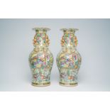A pair of Chinese Canton famille rose vases with palace scenes, antiquities and floral design, 19th