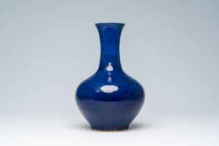 A Chinese monochrome blue glazed bottle vase, 19th C.