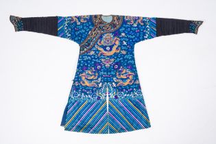 A Chinese finely embroidered blue-ground silk 'dragon' court robe, 19th C.