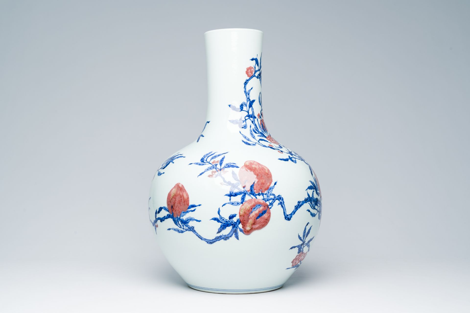 A Chinese blue, white and copper-red 'nine peaches' tianqu ping vase, Qianlong mark, 20th C. - Image 4 of 6