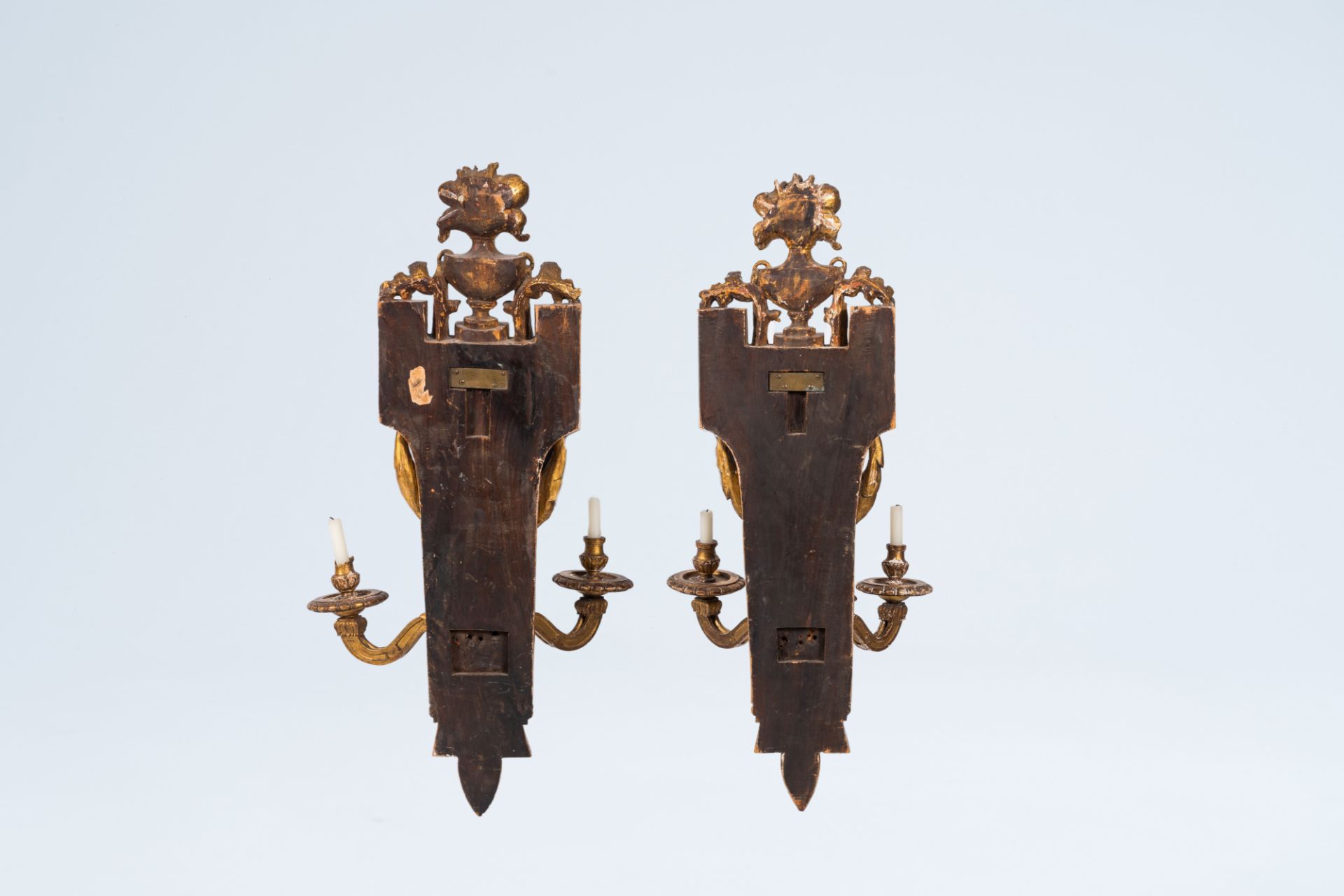 A pair of French Neoclassical gilt wood three-light wall appliques, 19th C.