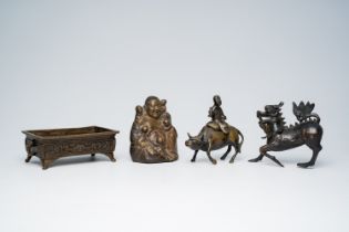 Three Chinese and Japanese bronze sculptures and a jardiniere, 19th/20th C.