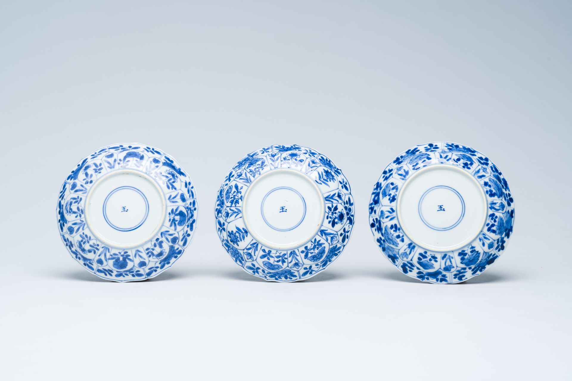 Six Chinese blue and white saucers with floral design, Kangxi - Image 5 of 5