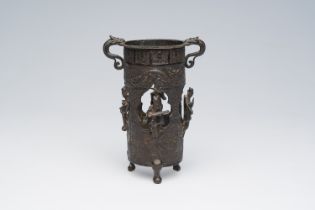 A Chinese tripod open worked bronze 'musicians' incense burner or brush pot, Ming