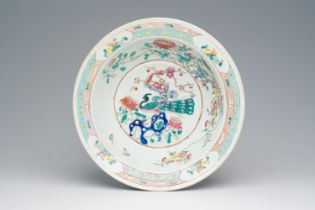 A Chinese famille rose bowl with a pheasant among blossoming branches, 19th C.