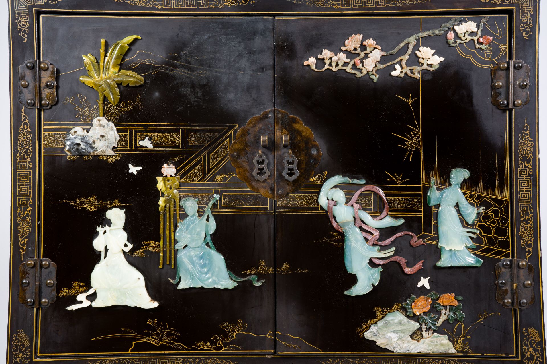 A Chinese lacquered wood cabinet inlaid with semi-precious stones showing ladies on a terrace, flowe - Image 5 of 13