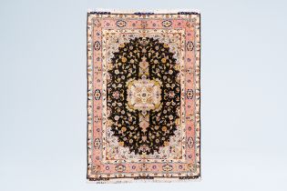 A Persian Goum rug with floral design, wool on cotton, Iran, 20th C.