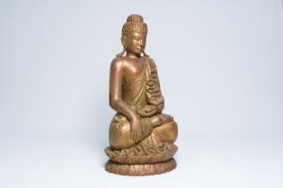 A tall Thai inlaid gilt wood figure of a seated Buddha, 20th C.