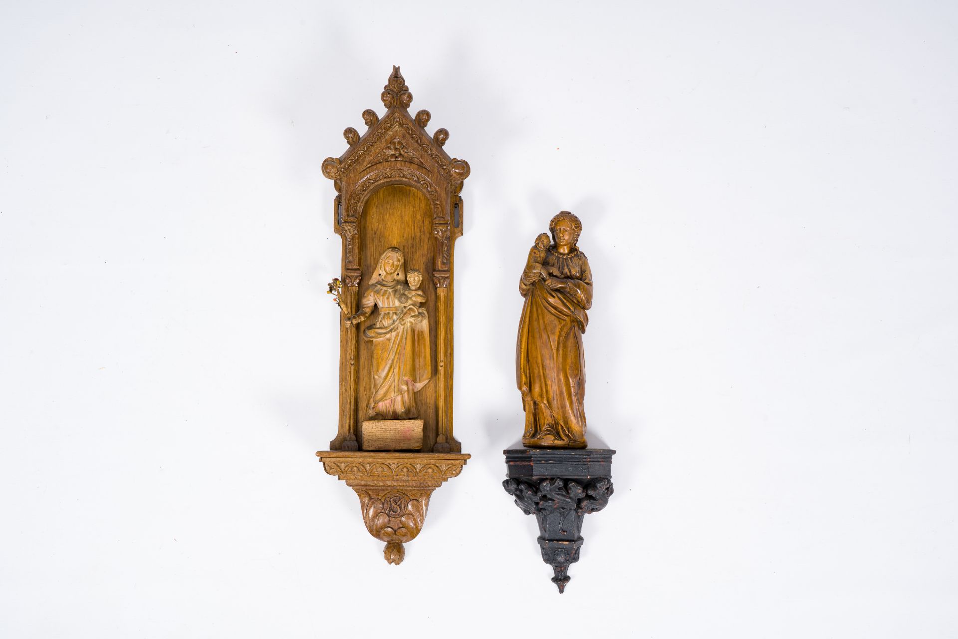 Two carved wood Virgin and Child sculptures with matching base, 18th/19th C.