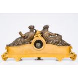 An impressive French gilt and patinated bronze and white marble mantle clock crowned with two muses