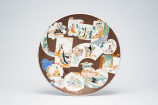 A Japanese Imari dish with figures in a landscape, Meiji, 19th C.