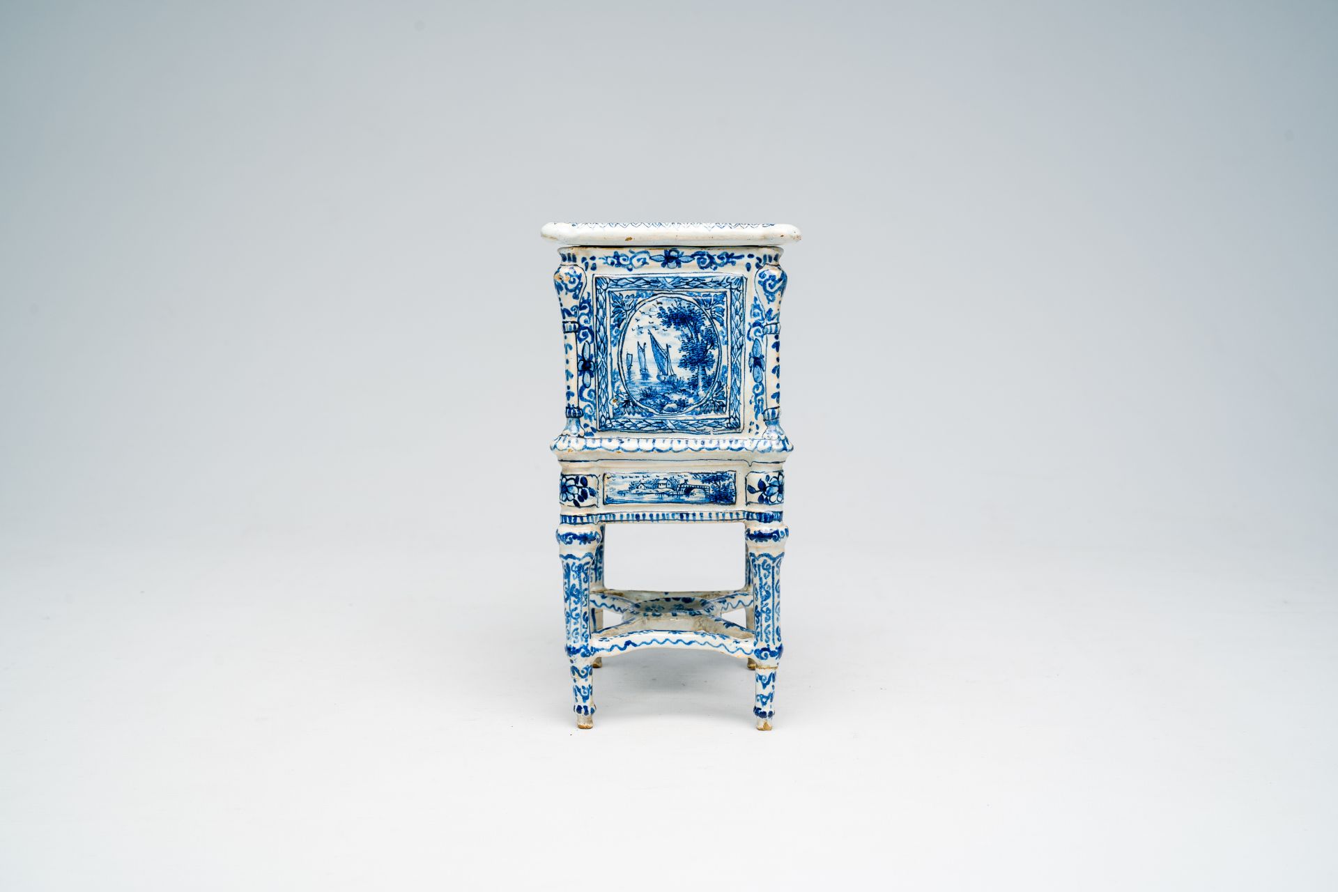 A French blue and white earthenware cabinet on stand with figures in a landscape and floral design, - Image 3 of 7