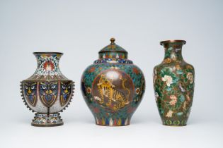 A Chinese cloisonne 'tiger' vase and cover and two vases with floral design, 19th/20th C.