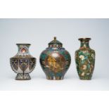 A Chinese cloisonne 'tiger' vase and cover and two vases with floral design, 19th/20th C.