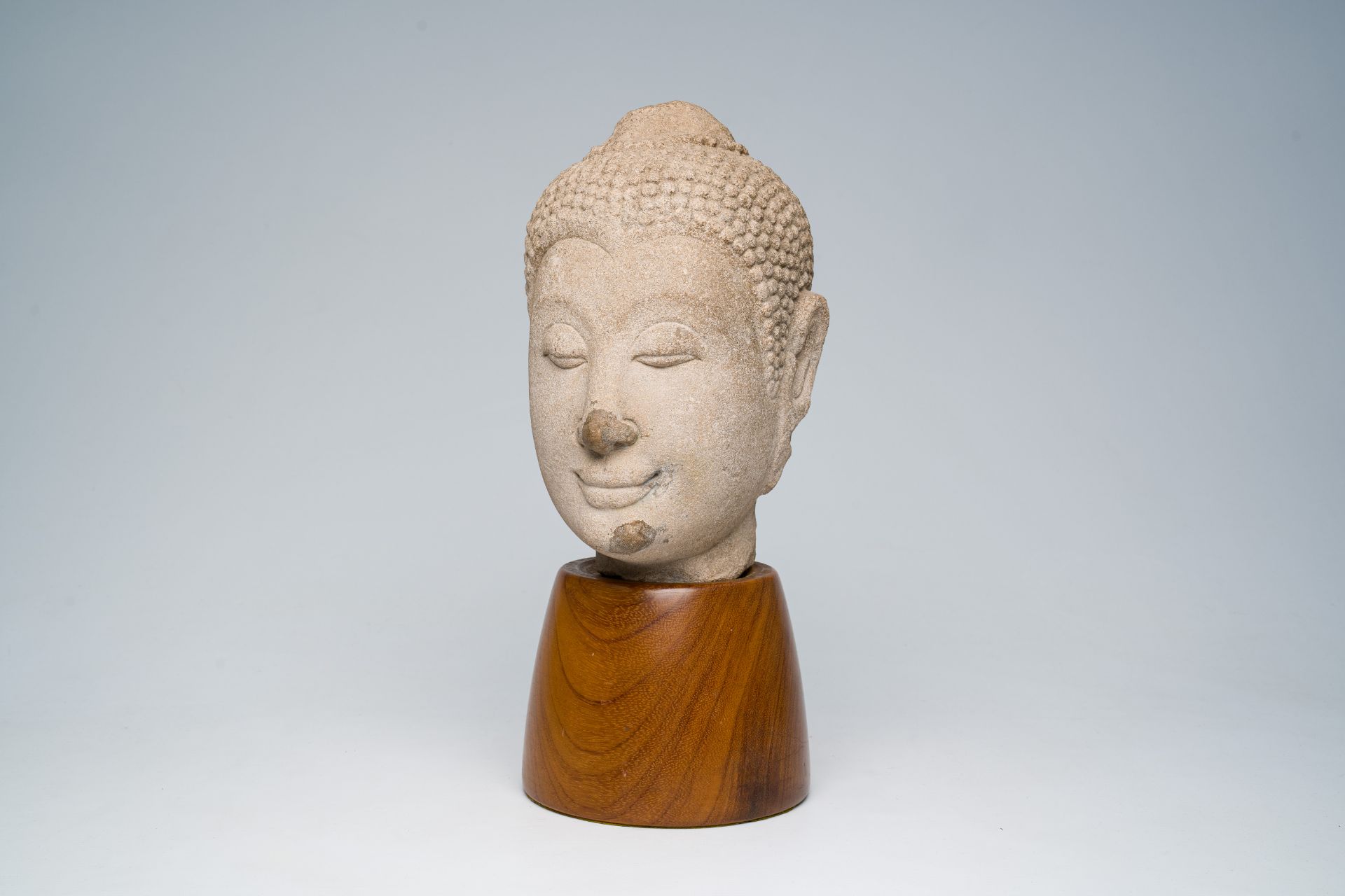 A Thai sandstone Ayutthaya style head of Buddha Shakyamuni, 17th C.