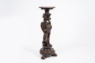 An Italian carved wood 'griffin' torchere stand, 20th C.