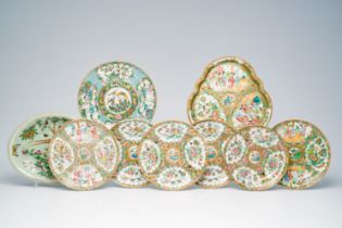 Nine Chinese Canton famille rose plates with palace scenes and birds and butterflies between blossom