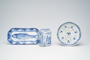 A Dutch Delft blue and white strainer, a 'chinoiserie' tea caddy and a 'herring' dish, 18th C. and l
