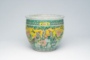 A Chinese famille verte jardiniere with birds among blossoming branches, 19th C.