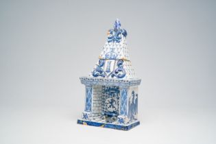 A Dutch Delft blue and white fireplace-shaped box and cover, ca. 1800