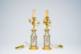 A pair of Chinese Canton famille rose vases with palace scenes and floral design mounted as lamps, 1
