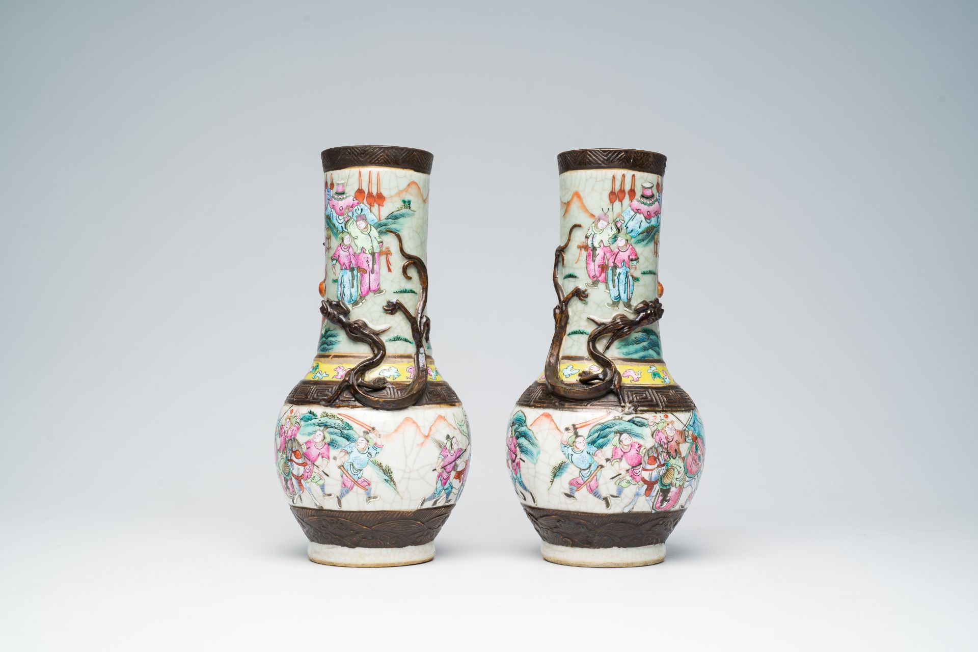 A pair of Chinese Nanking crackle glazed famille rose 'warrior' vases with dragons chasing the pearl - Image 2 of 6