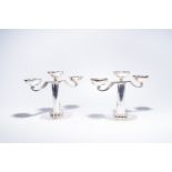 Jean Despres (1889-1980): A pair of French silver-plated design three-light candlesticks, Paris, sec