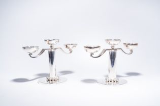 Jean Despres (1889-1980): A pair of French silver-plated design three-light candlesticks, Paris, sec