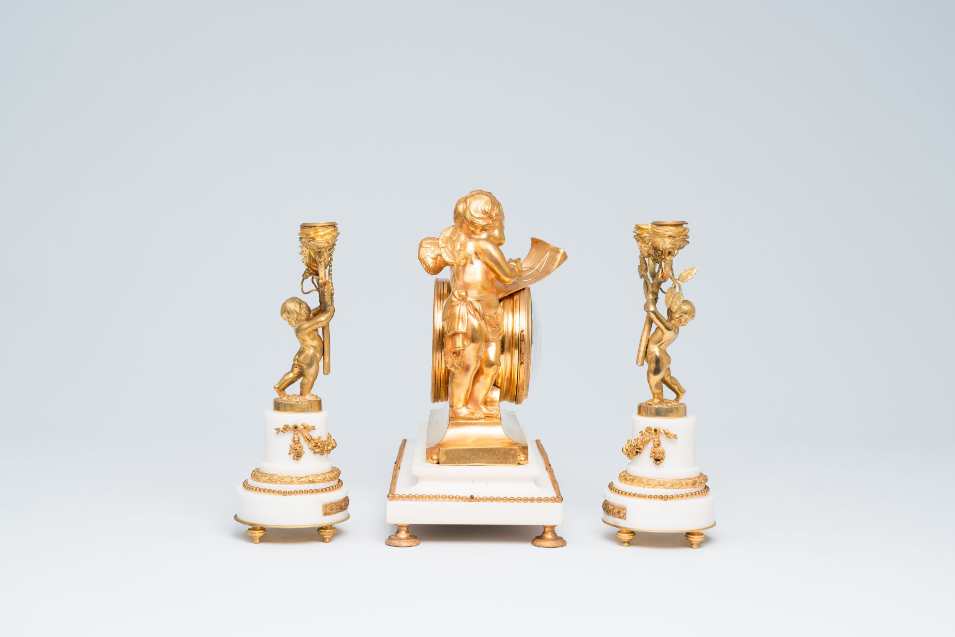 A French gilt bronze mounted white marble three-piece clock garniture with putti, 19th C. - Image 2 of 33