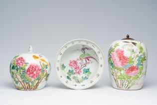 Two Chinese qianjiang cai jars and covers and a bowl with a bird among blossoming branches, 19th/20t