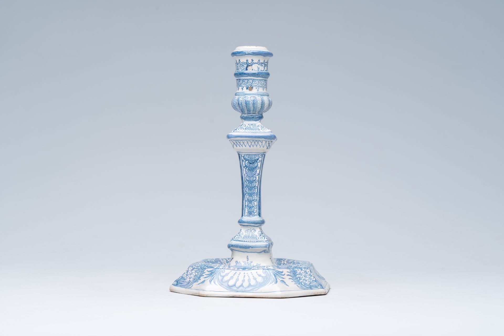 A German blue and white richly decorated earthenware candlestick, Nuremberg, 18th C. - Image 4 of 7