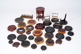 A varied collection of Chinese carved wood stands, 20th C.