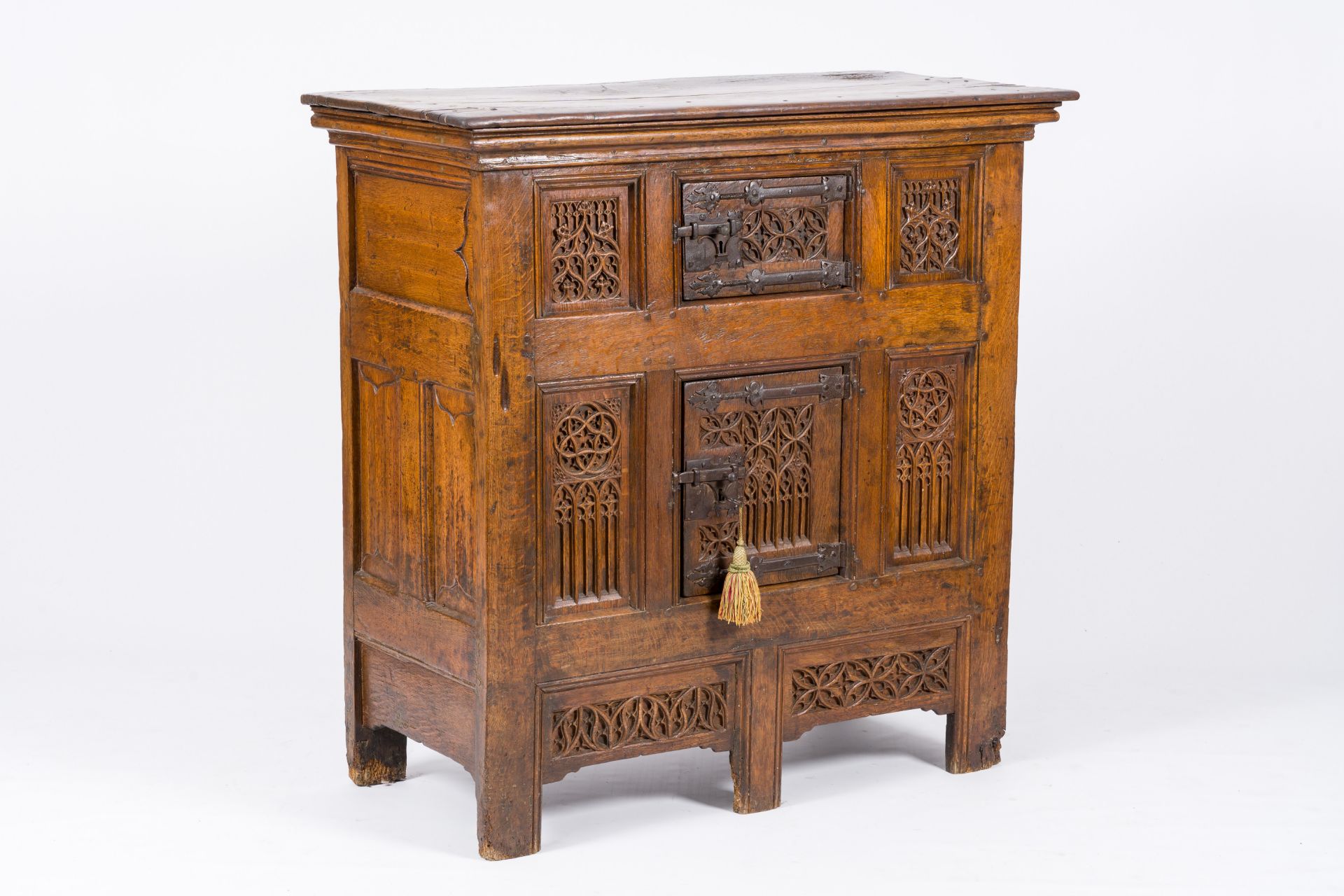 An exceptional Gothic wood two-door cupboard with linenfold and tracery panels, early 16th C.