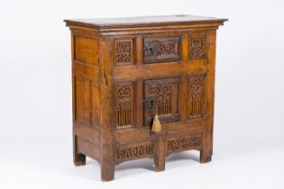 An exceptional Gothic wood two-door cupboard with linenfold and tracery panels, early 16th C.