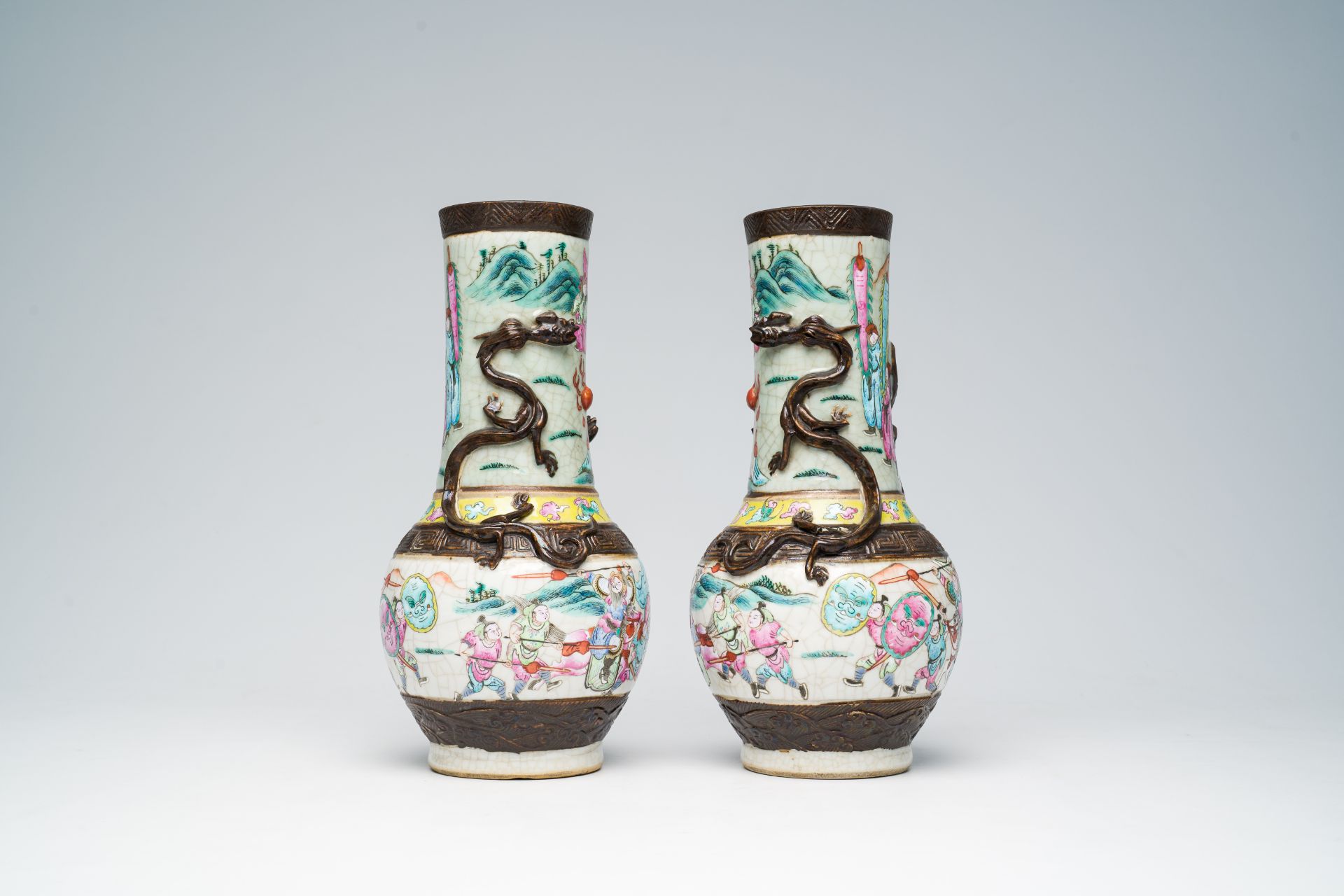A pair of Chinese Nanking crackle glazed famille rose 'warrior' vases with dragons chasing the pearl - Image 4 of 6