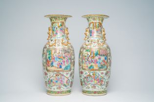 A pair of Chinese Canton famille rose vases with palace scenes and floral design, 19th C.